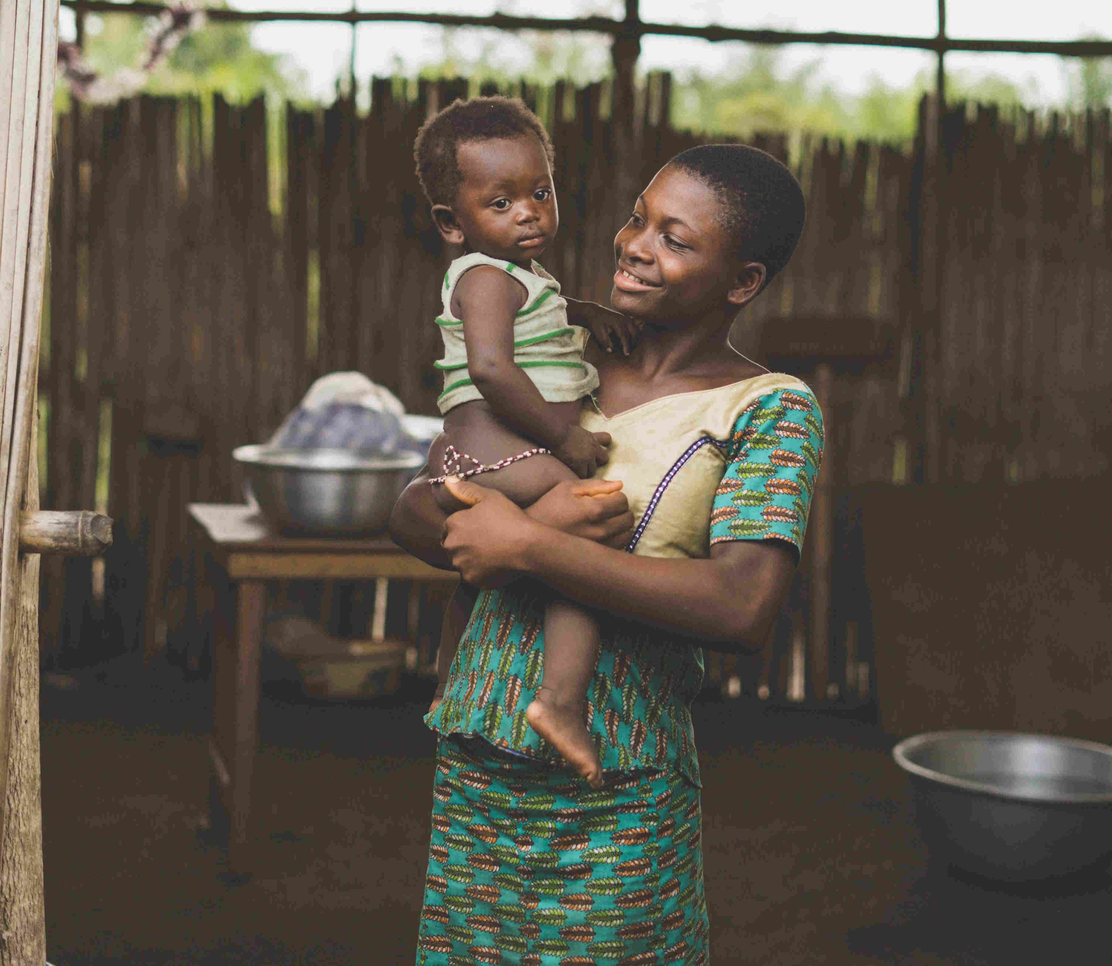 Woman carrying child